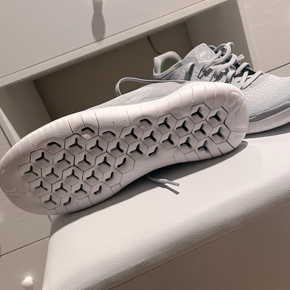 Grey and White Nike shoes
